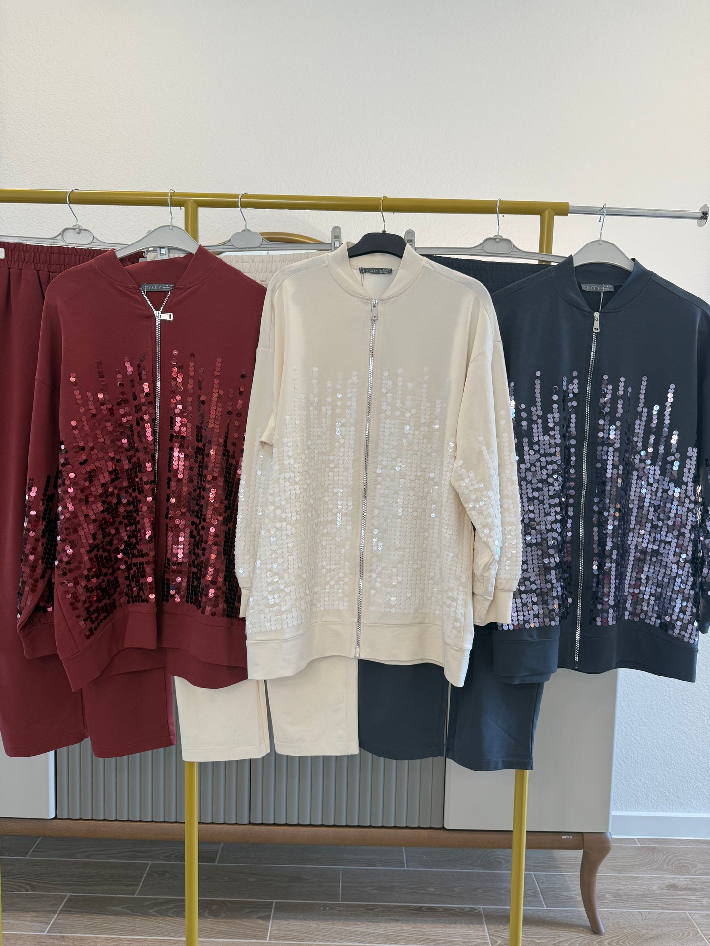 Two-piece sequin tracksuit.