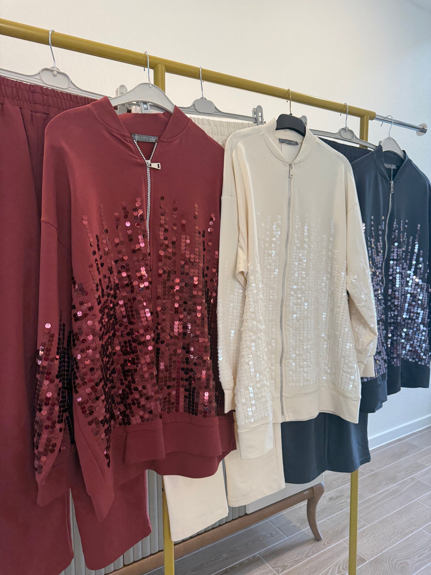 Two-piece sequin tracksuit.