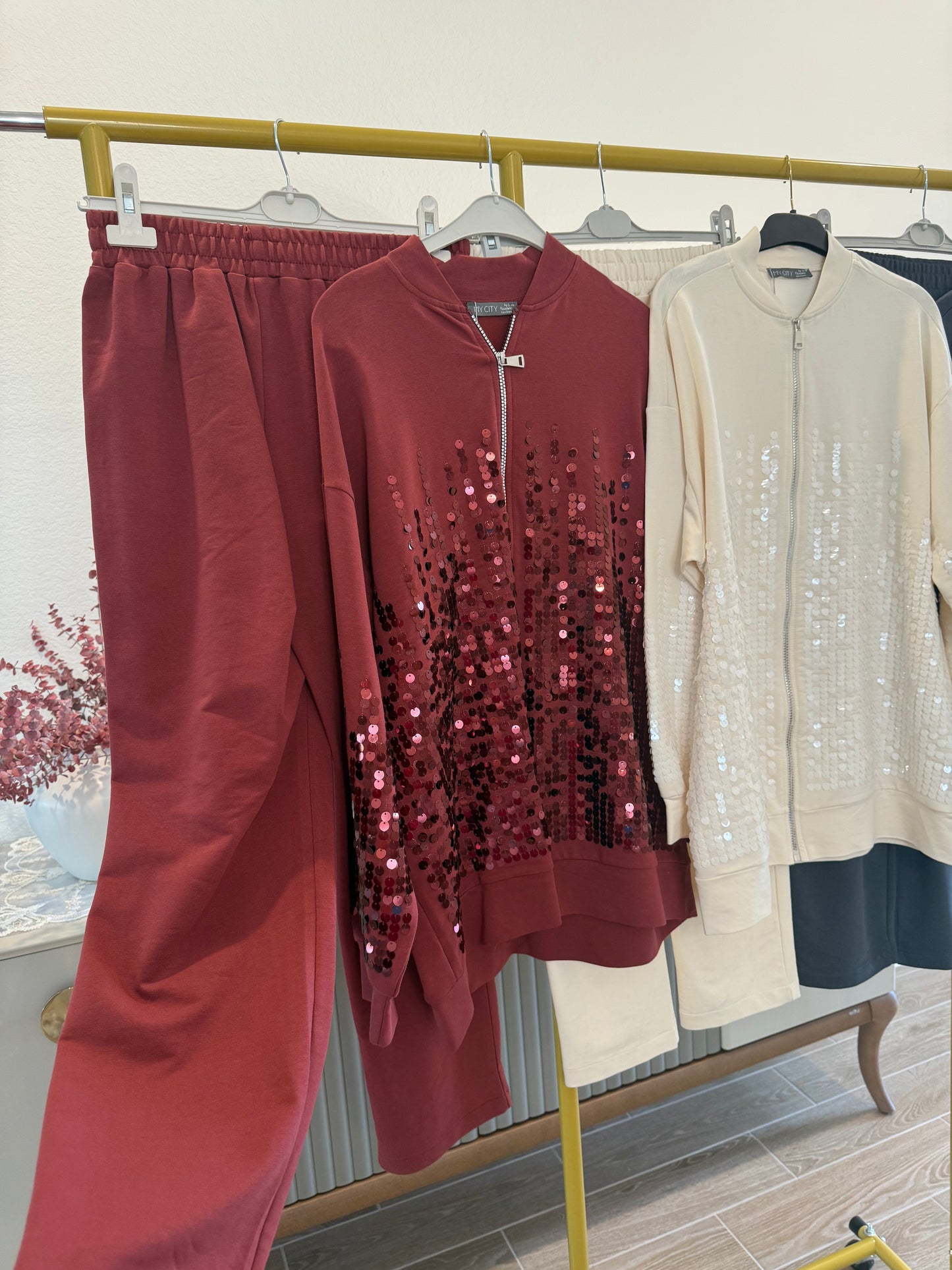 Two-piece sequin tracksuit.