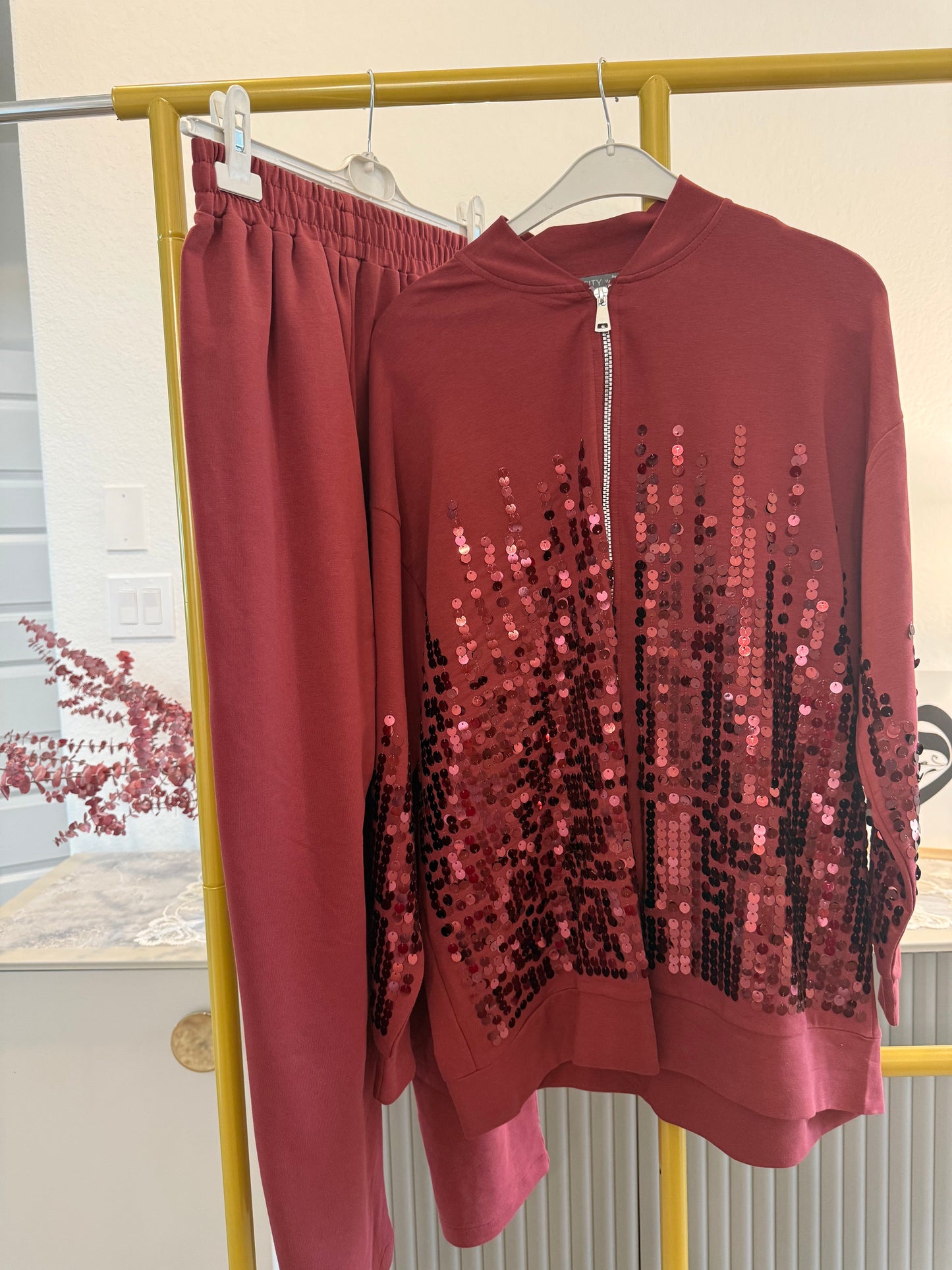 Two-piece sequin tracksuit.