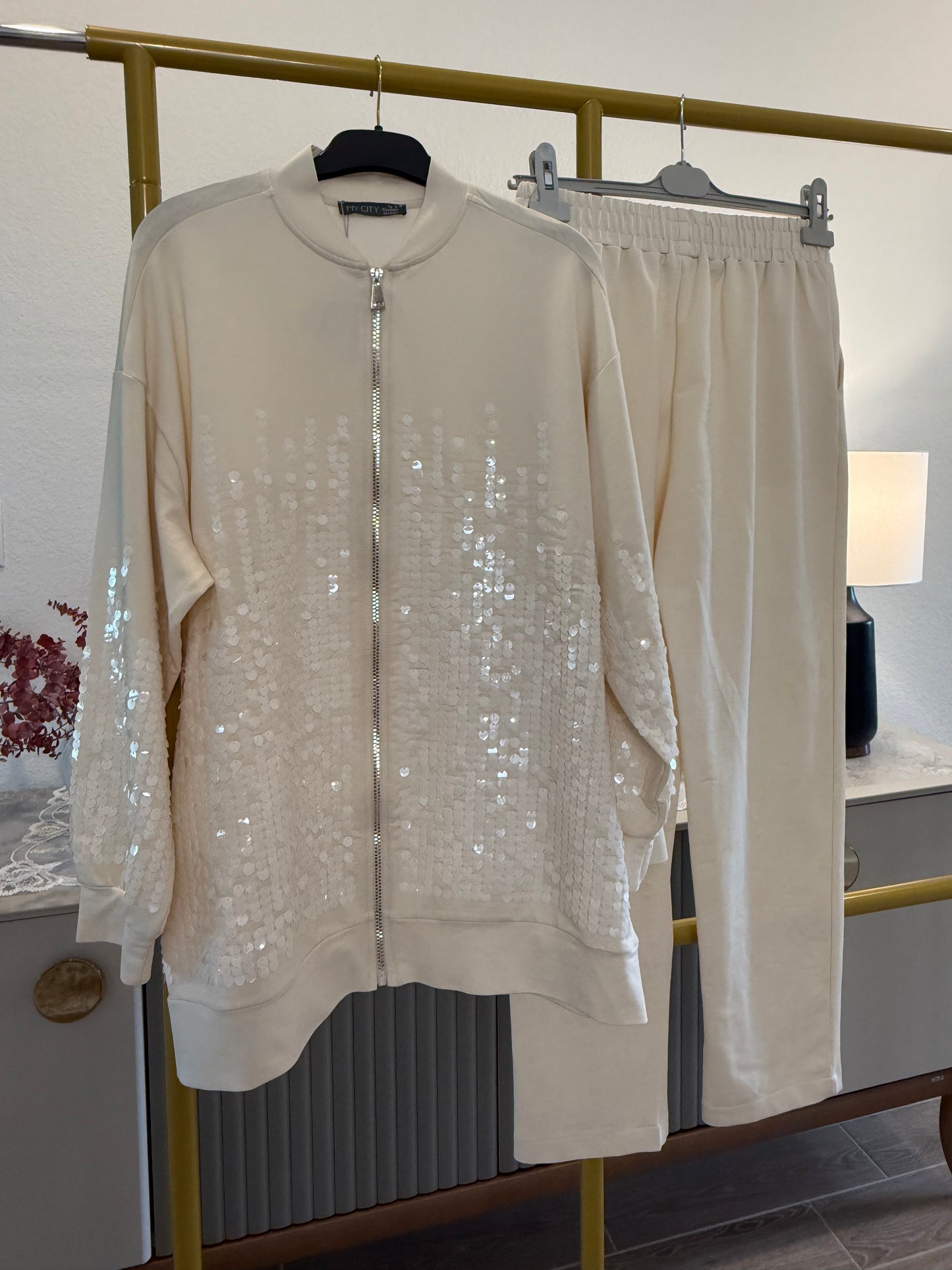 Two-piece sequin tracksuit.