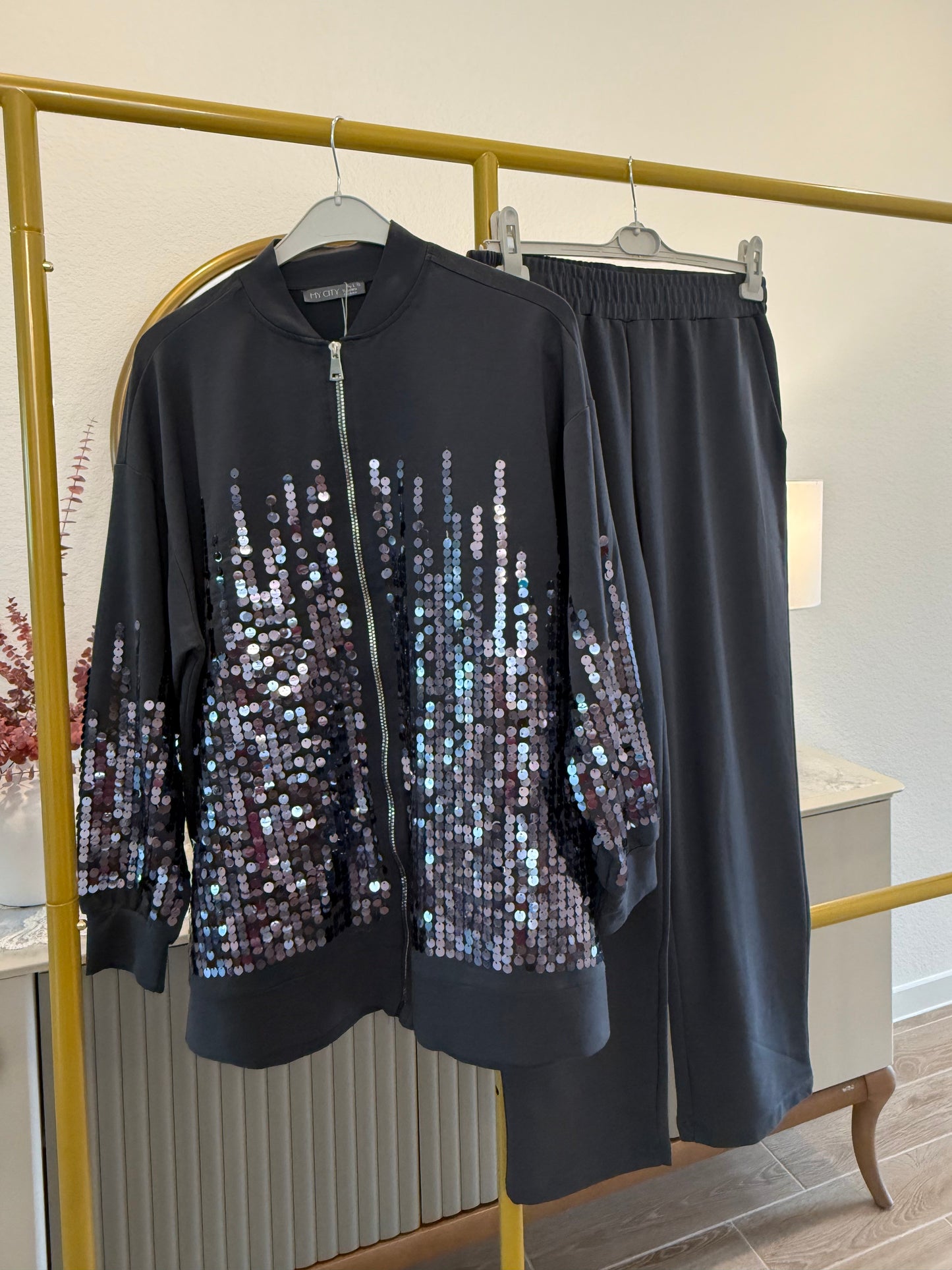 Two-piece sequin tracksuit.