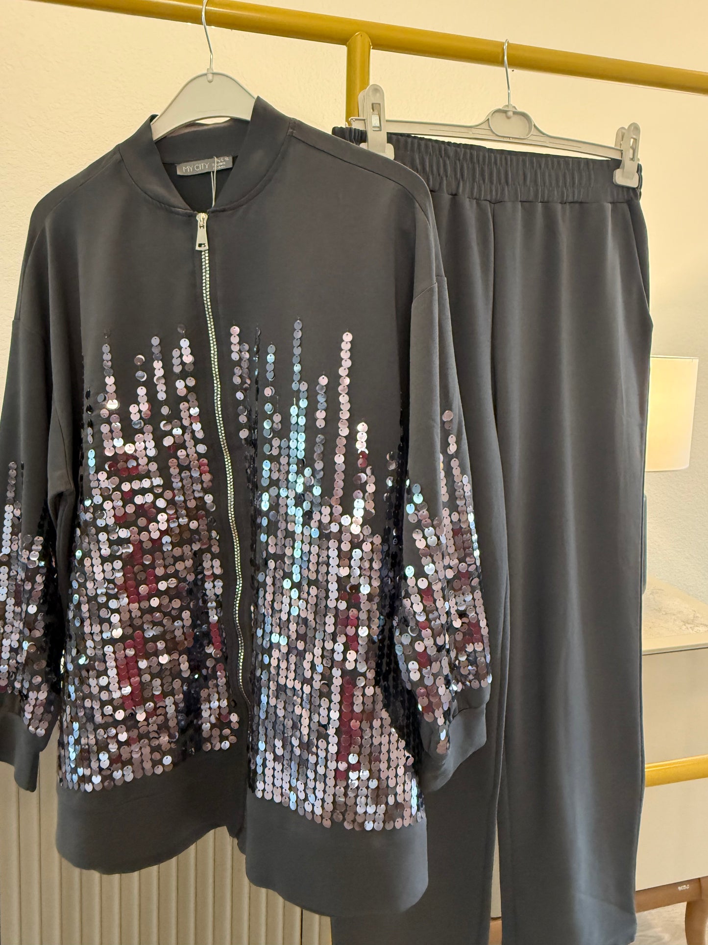Two-piece sequin tracksuit.