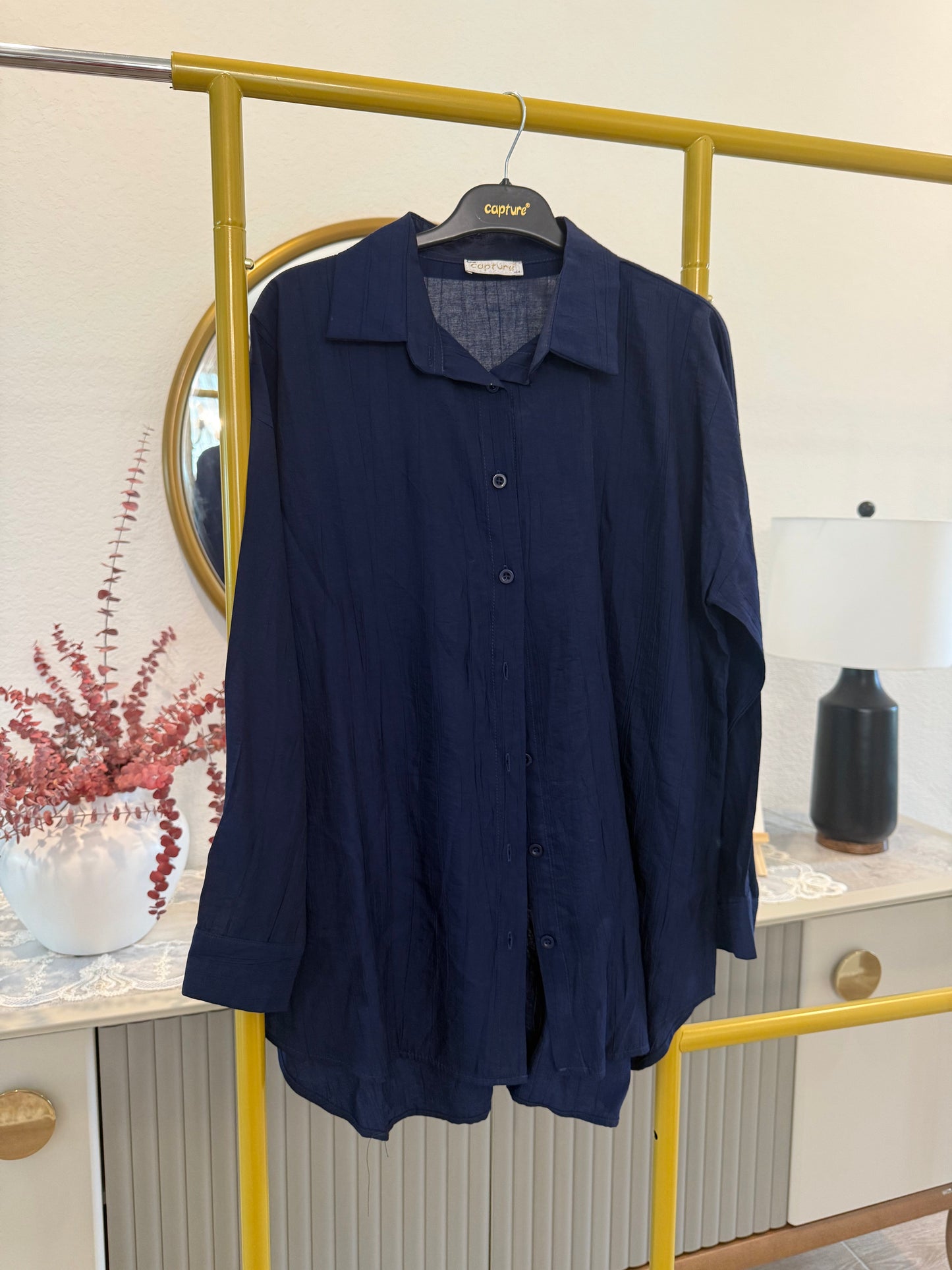 A classic longline button-down shirt in deep navy blue