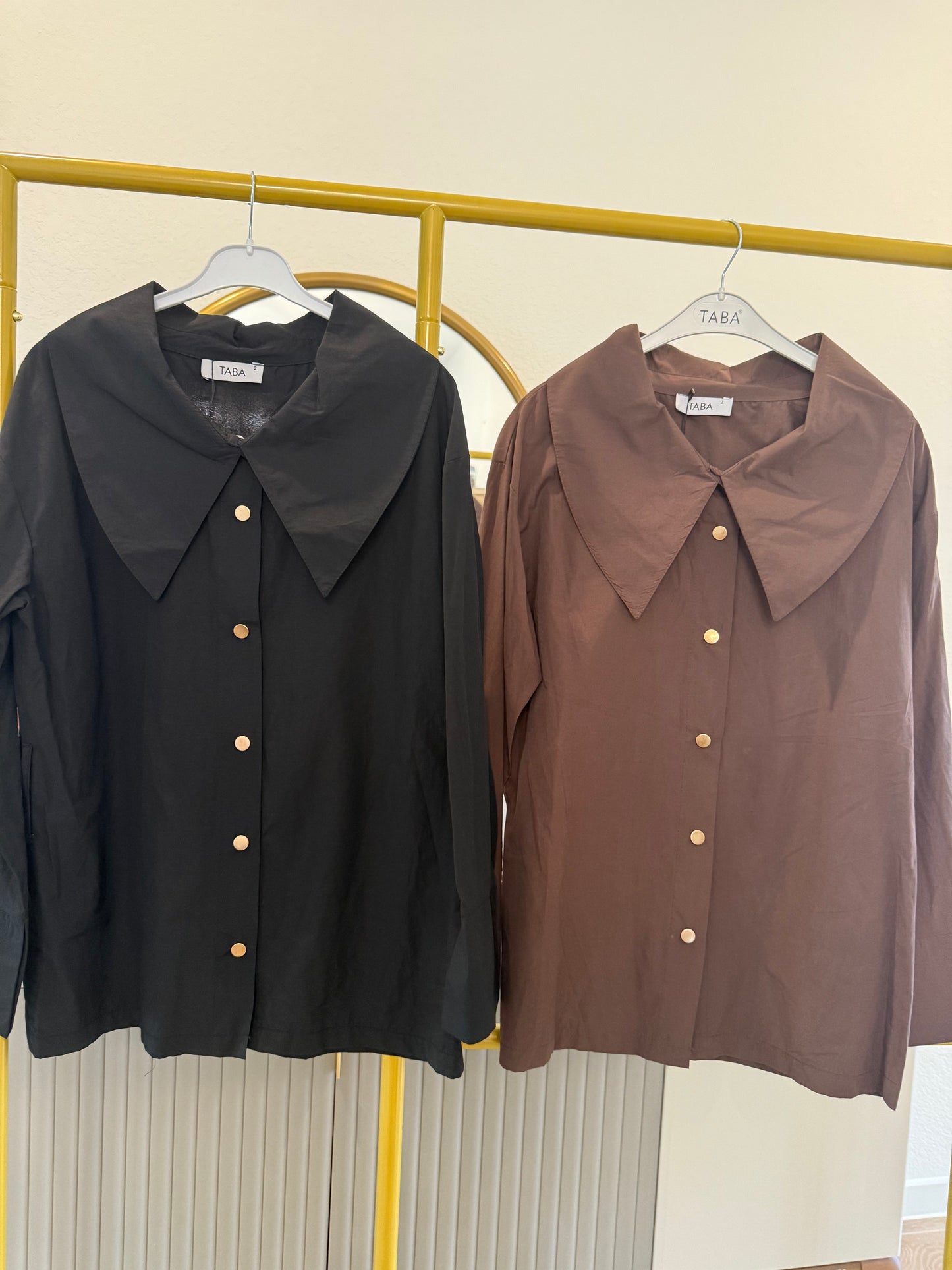 Long-sleeve button-down blouse with a bold oversized collar