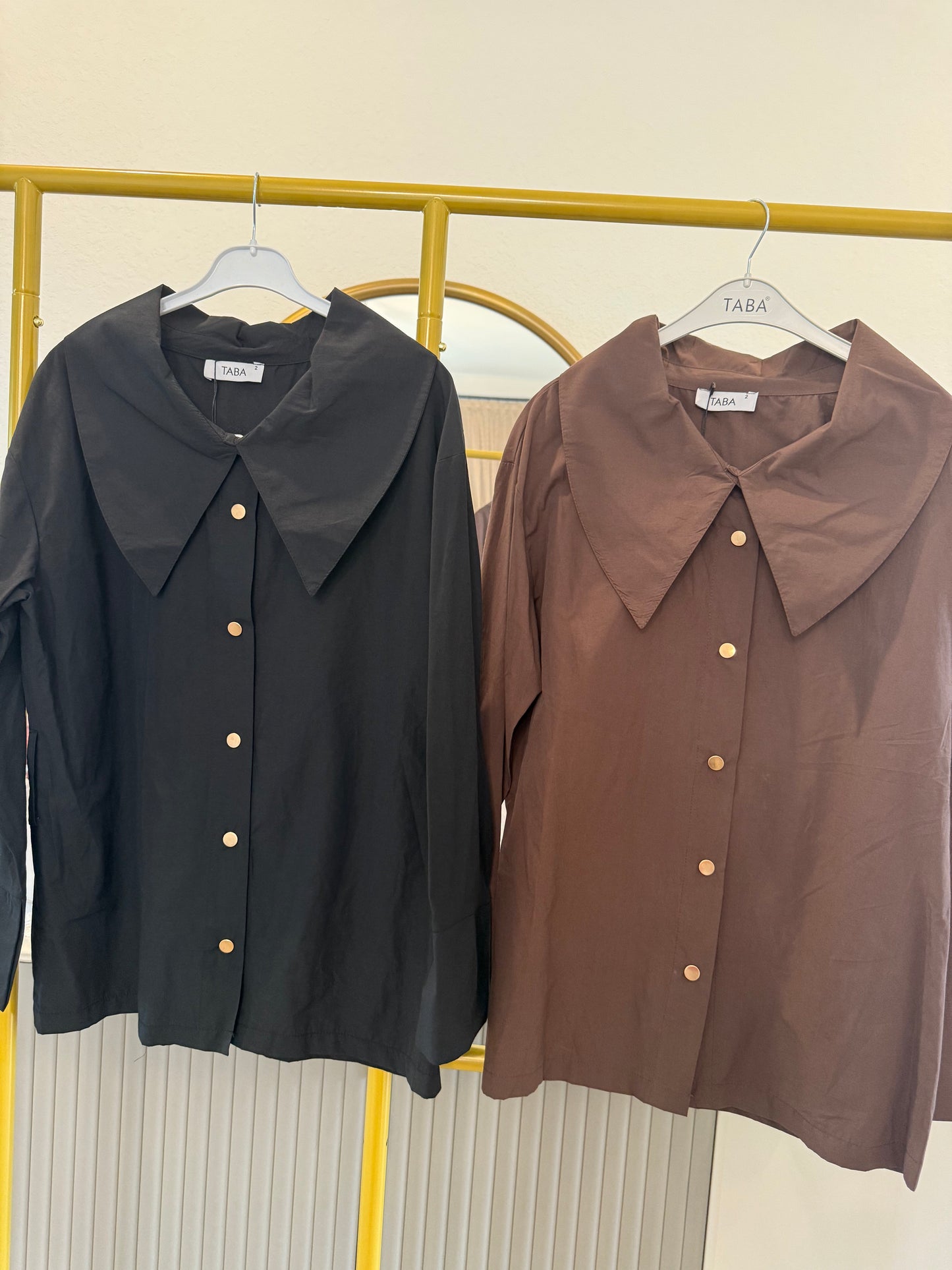 Long-sleeve button-down blouse with a bold oversized collar