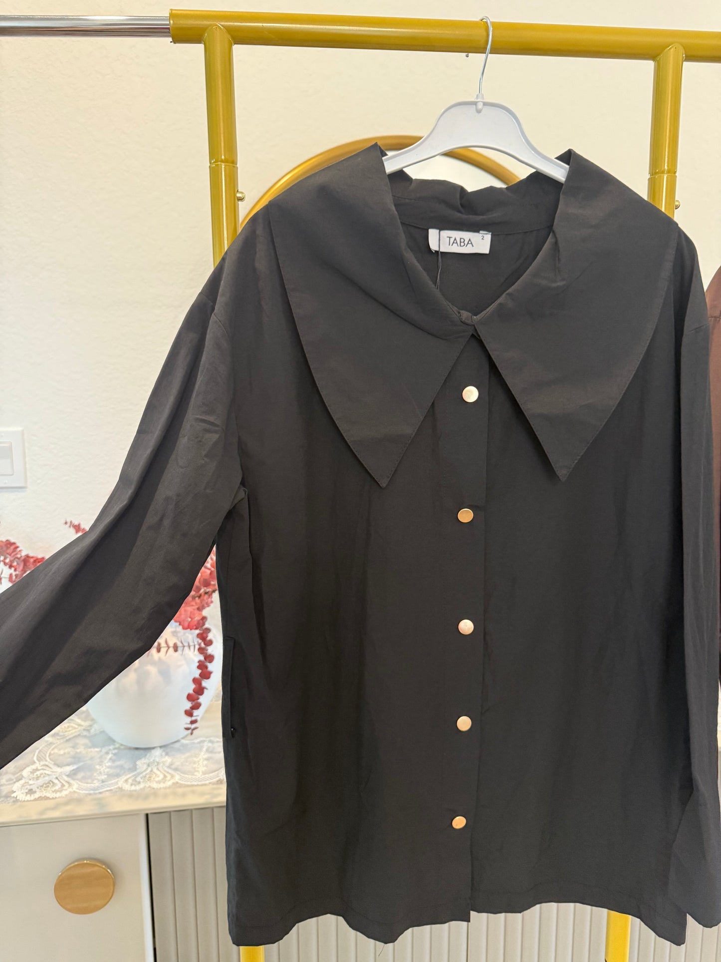 Long-sleeve button-down blouse with a bold oversized collar