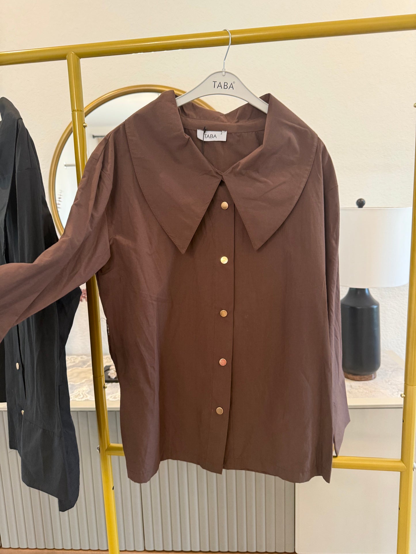Long-sleeve button-down blouse with a bold oversized collar