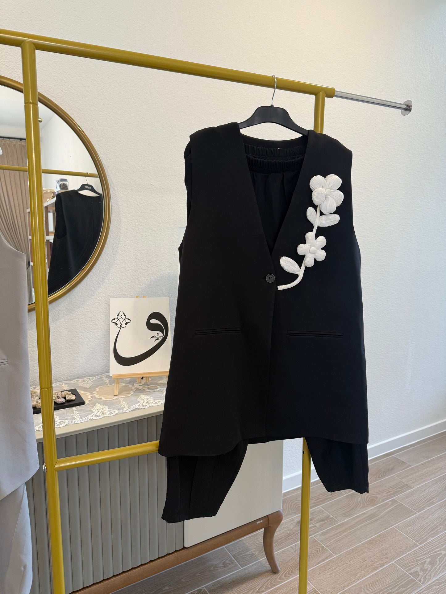 A two-piece sleeveless vest and pants set