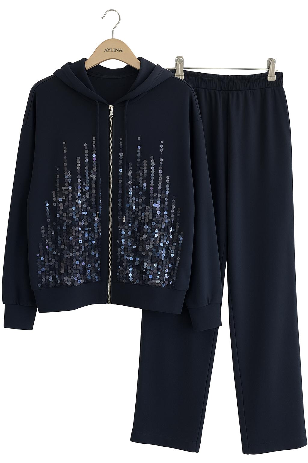 Two-piece sequin tracksuit.